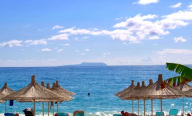 beach and hut during daytime