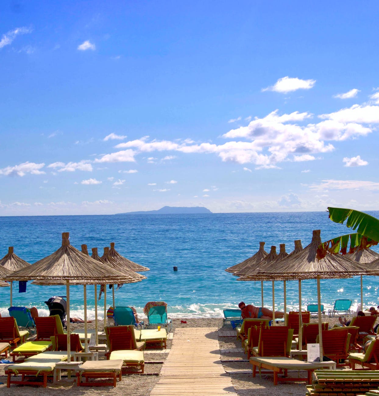 beach and hut during daytime